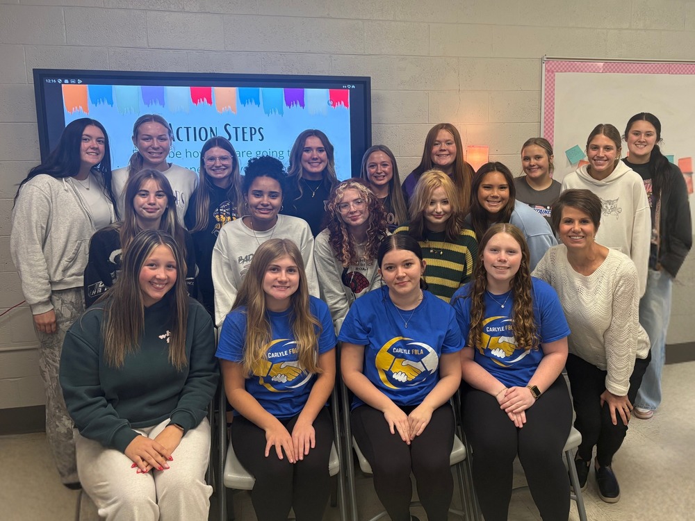 Students pose with Mrs. Weh for a photo after the lunch and learn