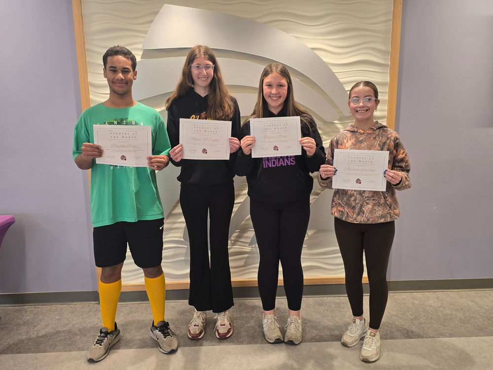 Freshman Preston Wise, sophomore Rachel McDuffey, junior Briana Macke, and senior Alannah Sarclette receive awards for being named February CHS Students of the Month. 