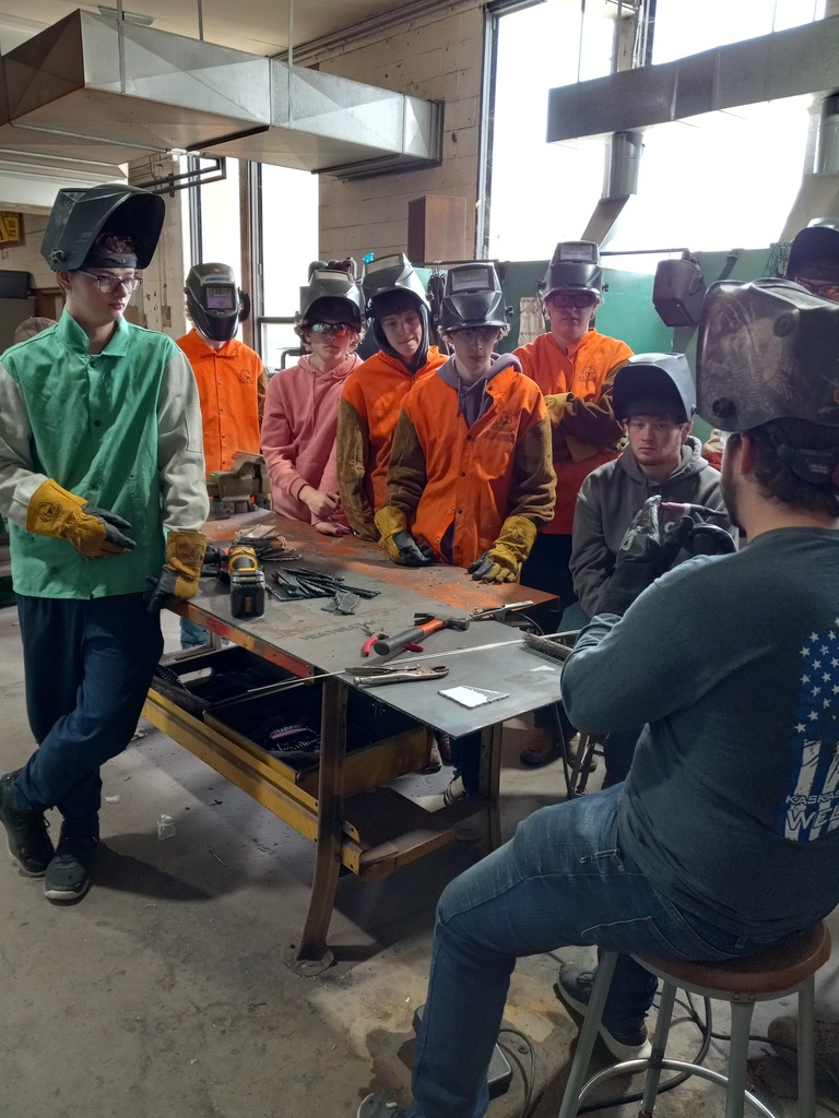 Students learn about welding in the shop