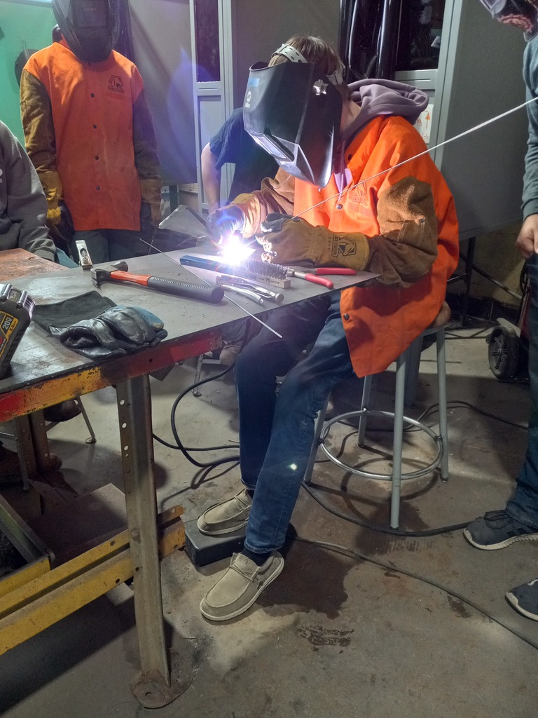 Students learn about welding in the shop