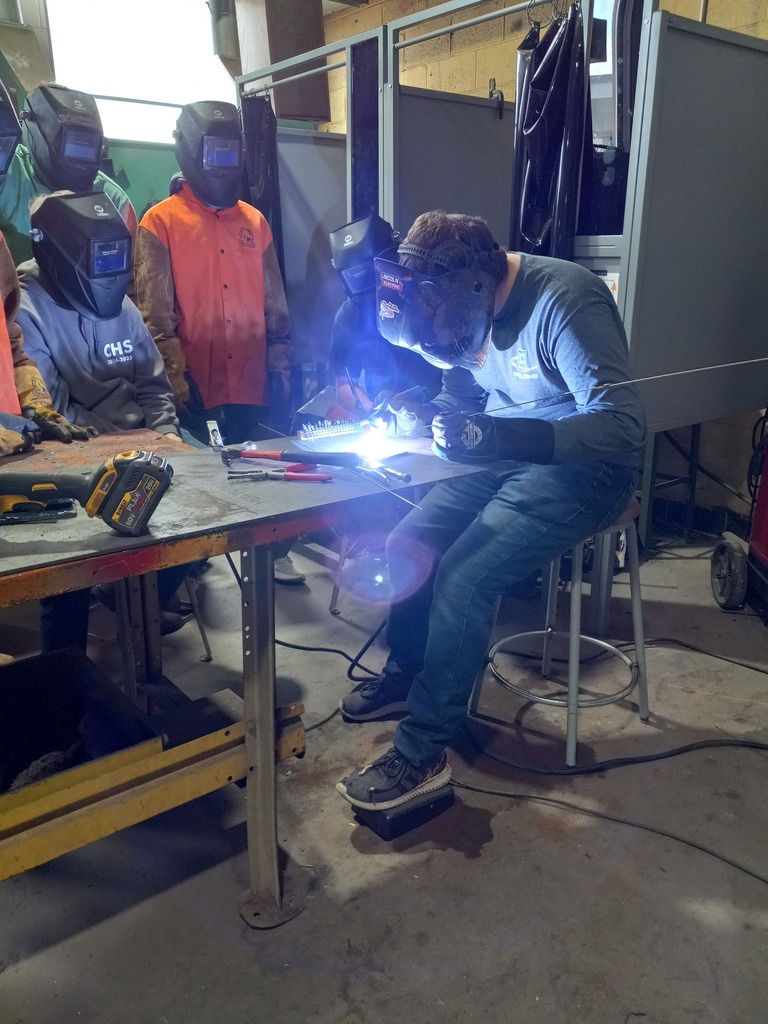 Students learn about welding in the shop