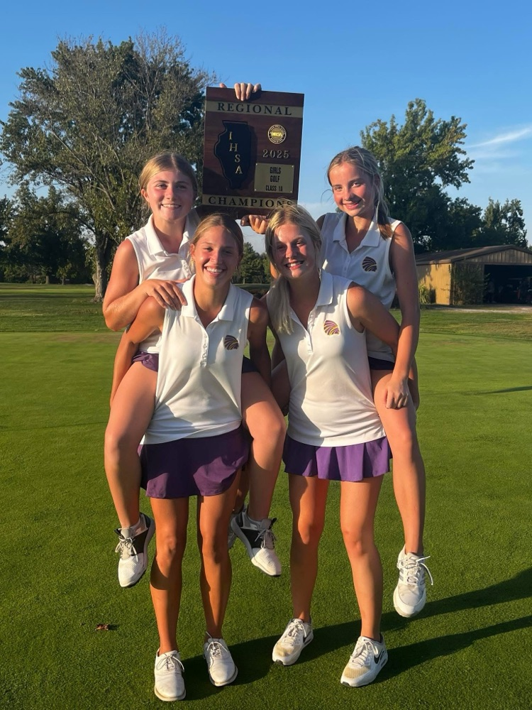 4 teenage girls in matching golf uniforms pose on the golf course with a trophy