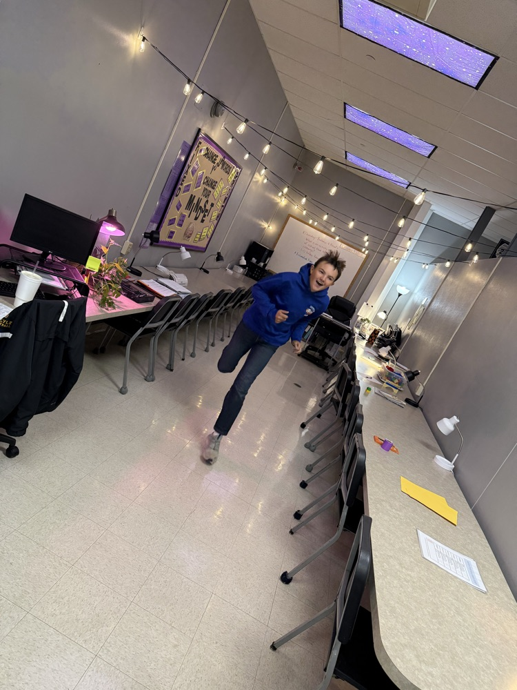 a student runs across the room