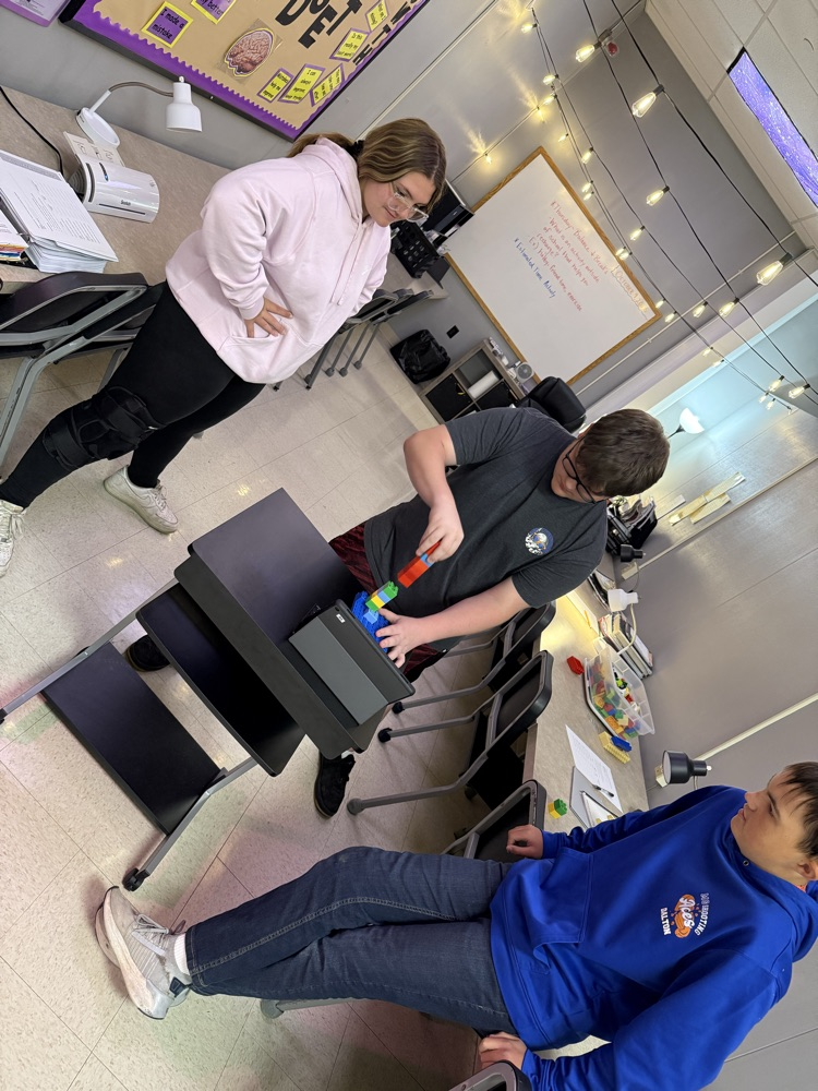 students work together with legos