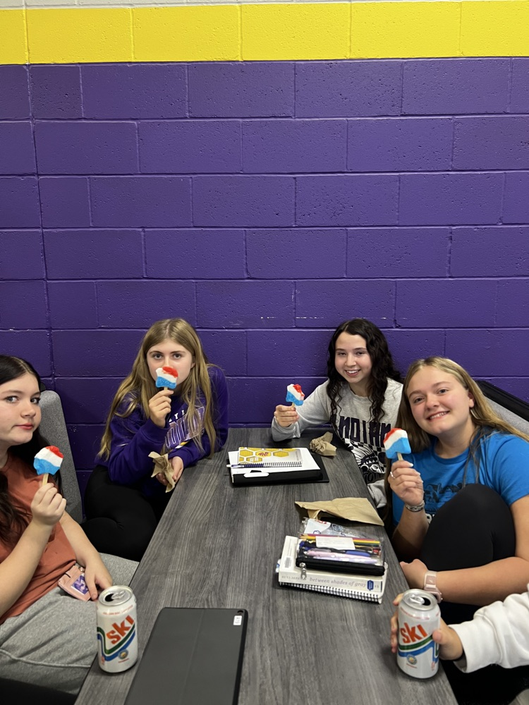 students pose with rewards