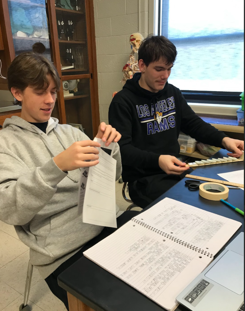 2 male students work together on the lab