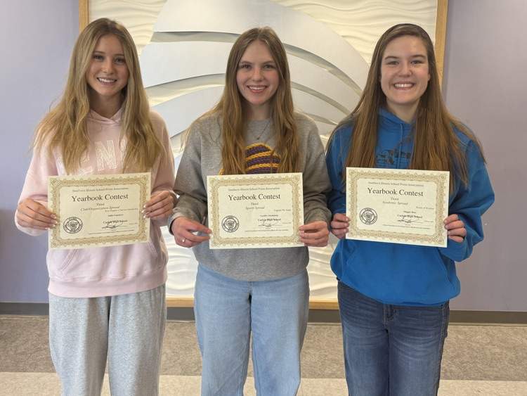 photo of 3 students holding certificates