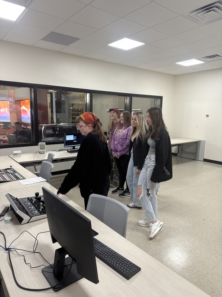 SIUE graduate student Chloe Wolfe shows Maggie Bass, Brooke Kleiboeker, Kamille Salyers, and Katie Rakers the control room for the broadcast studio. Students learned to adjust the sound and lights while their peers prepared for the mock broadcast.