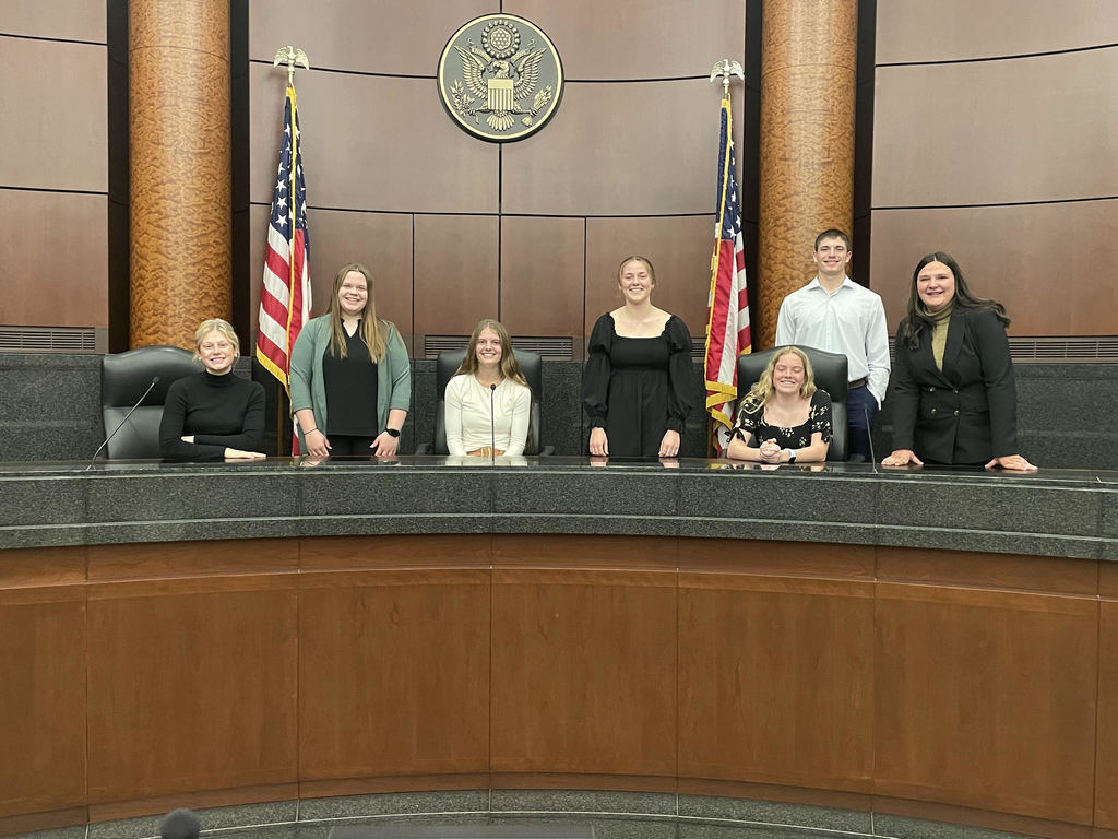 Group photo of students in the courtroom