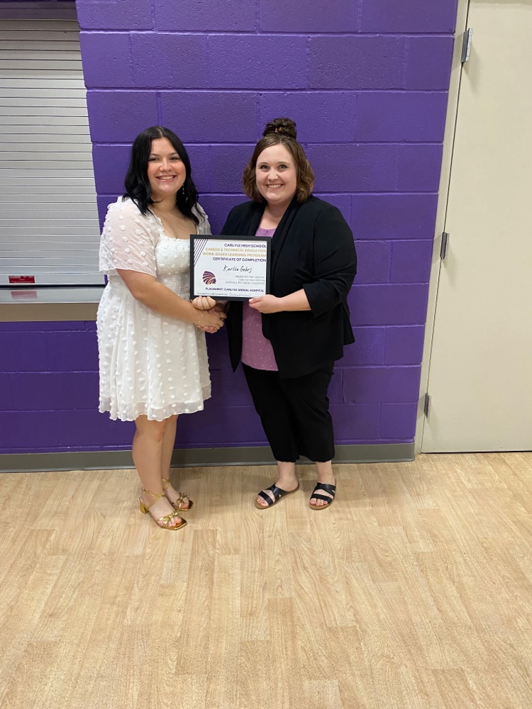 photo of Karlie getting certificate from Mrs. I 