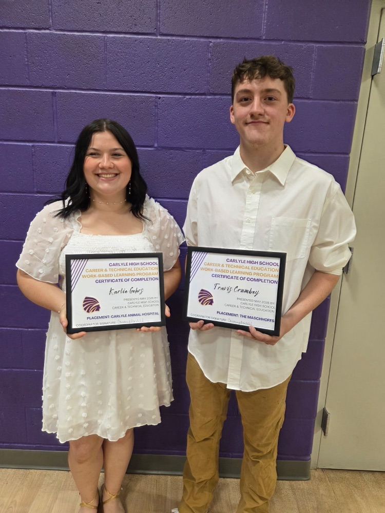 photo of Karlie and Travis with certificates 