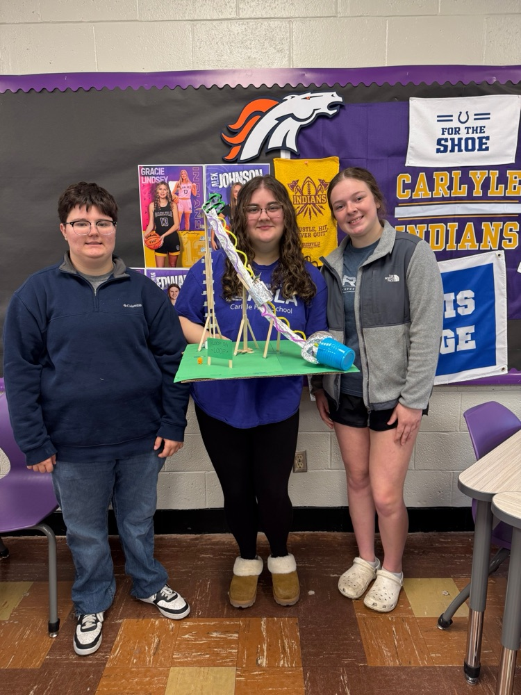 students pose with their coasters