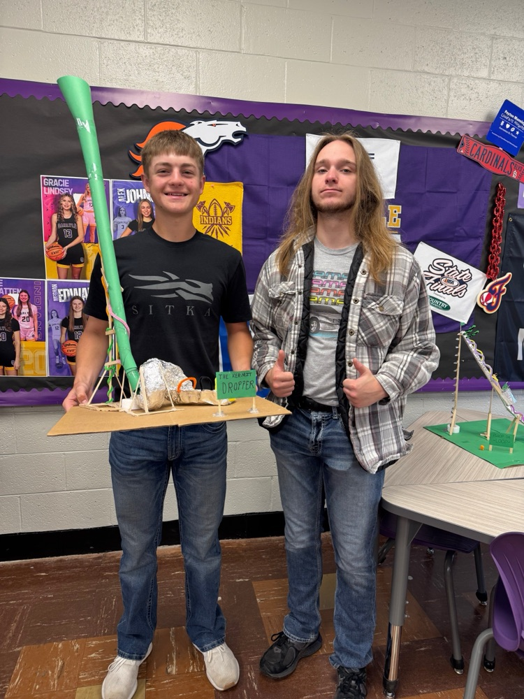 students pose with their coasters