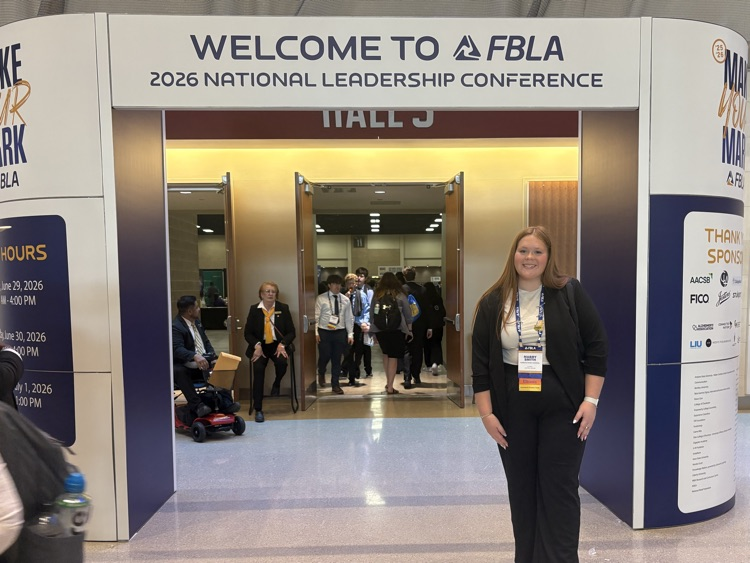 Mabry at the entrance of the conference