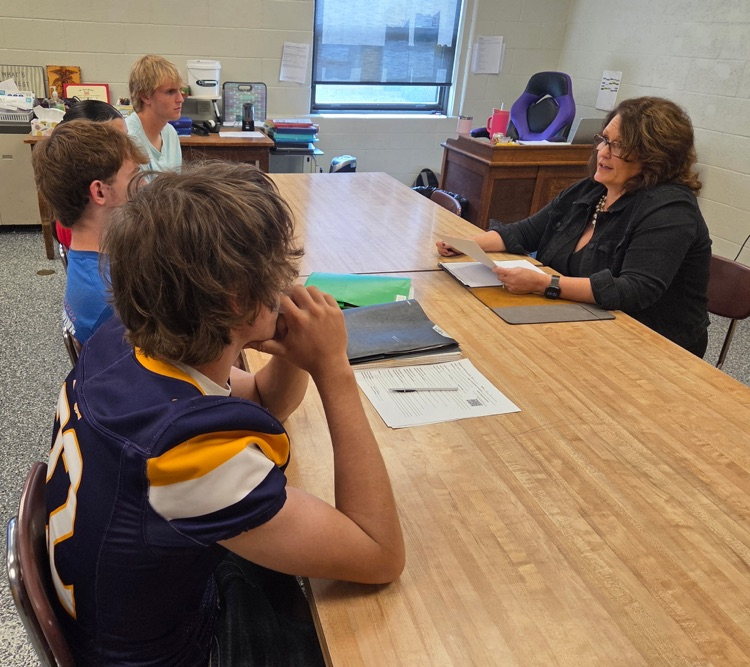 Lori Jansen speaks to workbase learning students in a classroom