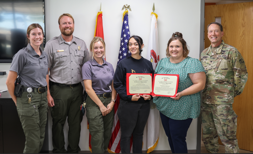Ibendahl and Hayes pose with their certificates and the US Army Corp of Engineers
