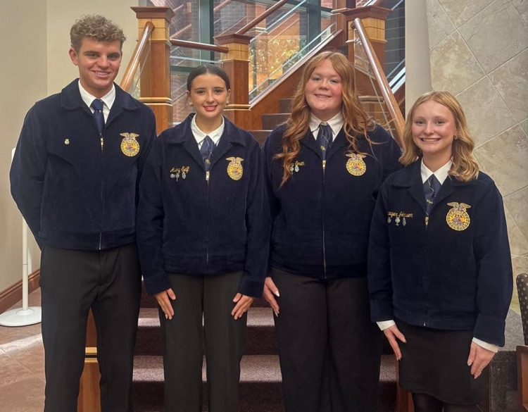 the four top finishers smile for a PHOTO wearing FFA official dress in front of a staircase at the Maschoffs