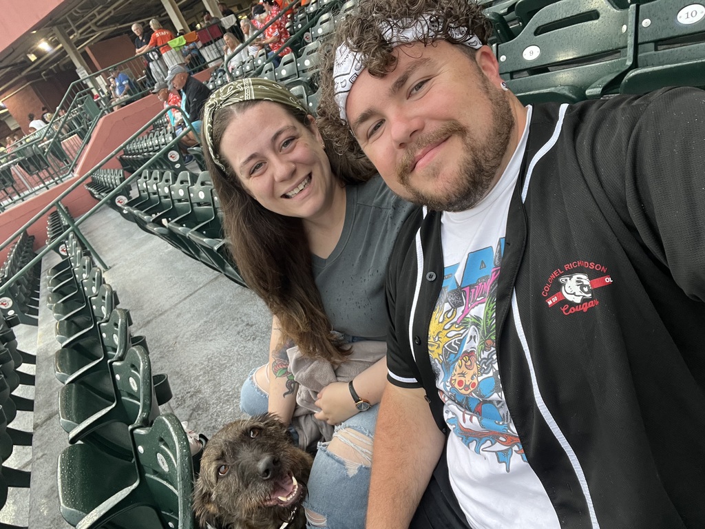Mr. Lyles and his fiancée Ms. Teddi Jo decided to share a day at the ballpark with their dog, Newt.
