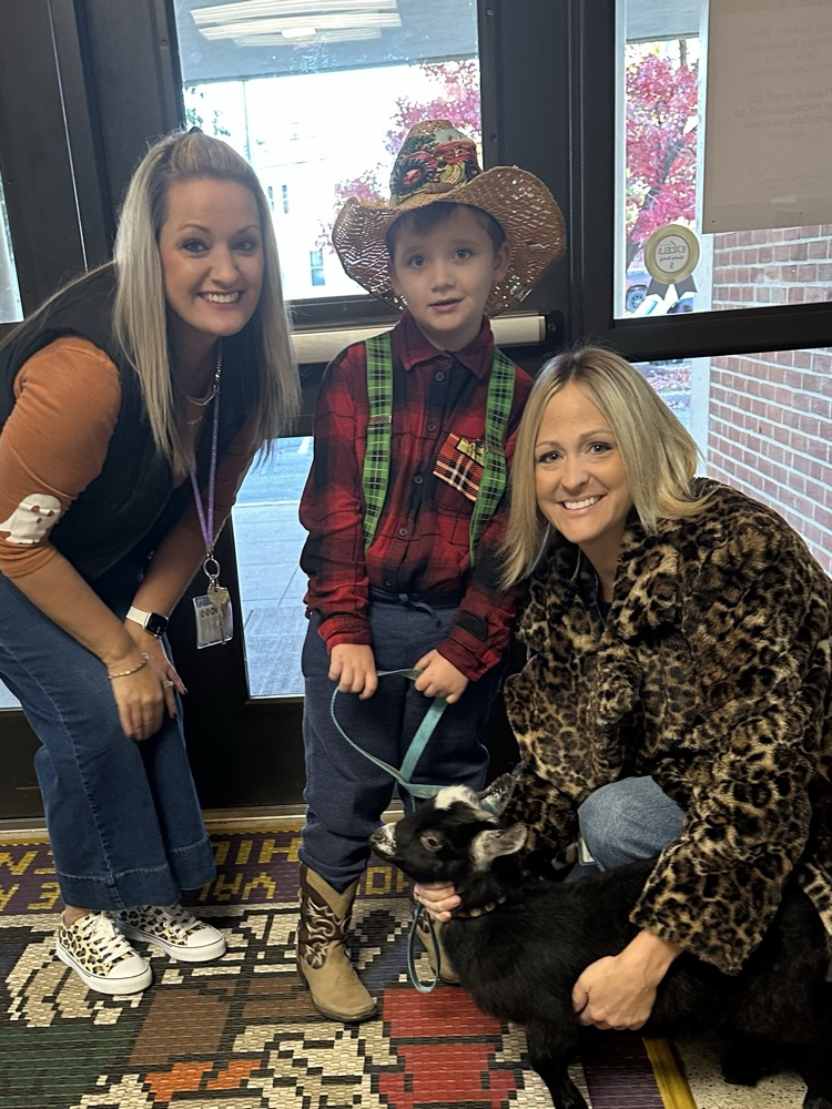 staff w student and goat 