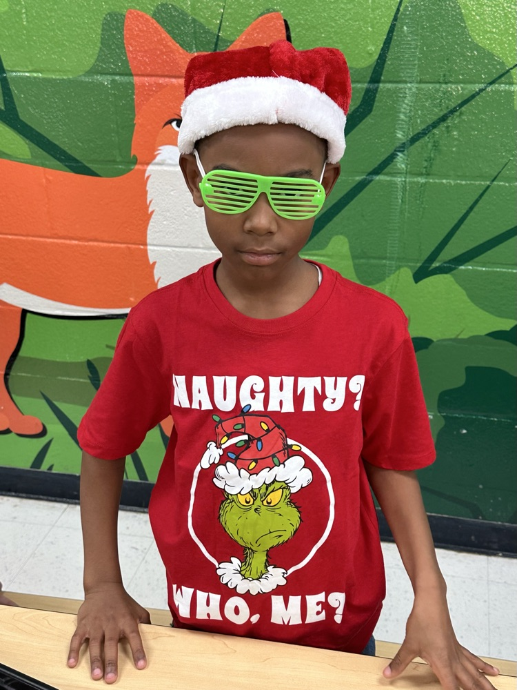 child in grinch shirt