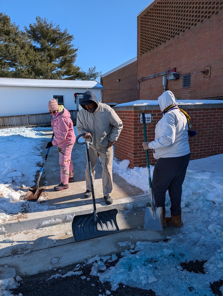 Three Custodians shoveling snow