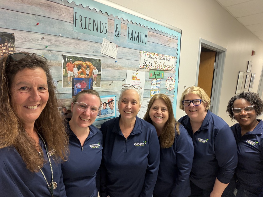six coworkers in matching shirts