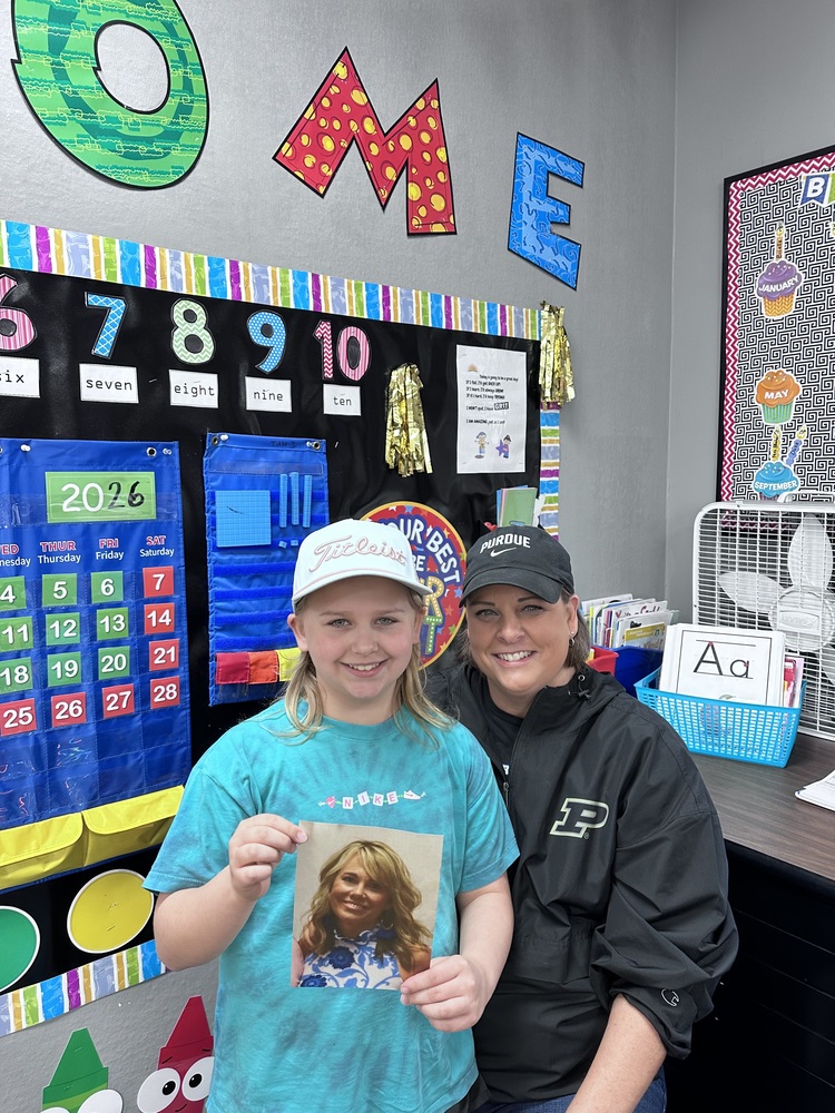Student and teacher wearing hats