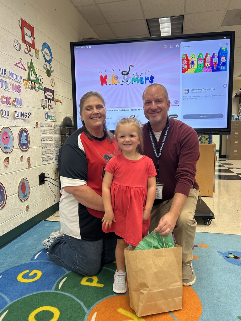 Picture of Pre-K Book Challenge winner with teacher and principal