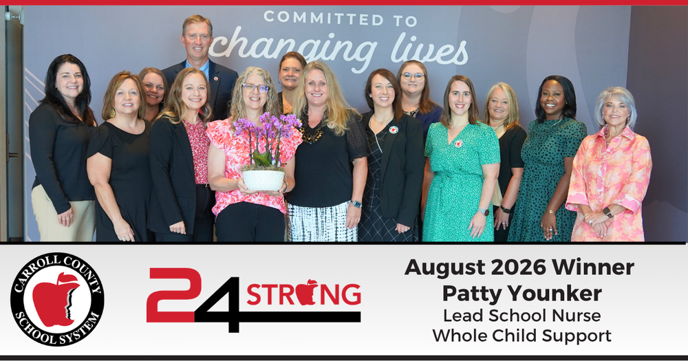 24strong winner for august 2026 is patty younker, lead school nurse. Patty posing with a group of district coworkers