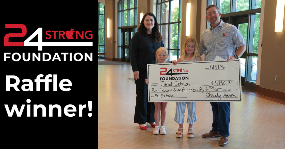 24STRONG Educational Foundation Raffle Winner Jared Johnson with two daughters, big check and Charity