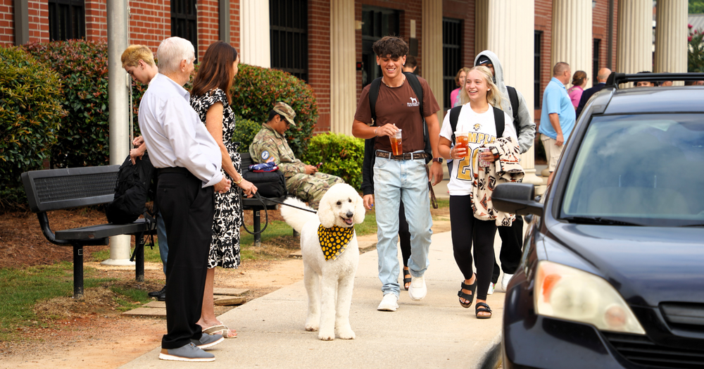 THS students are greeted by community members and Carroll County's first dog, Apollo as they arrive for the second day of school