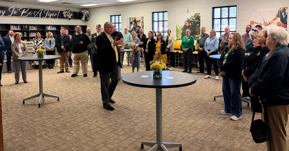 scott cowart speaks to community partners inside temple high school media center