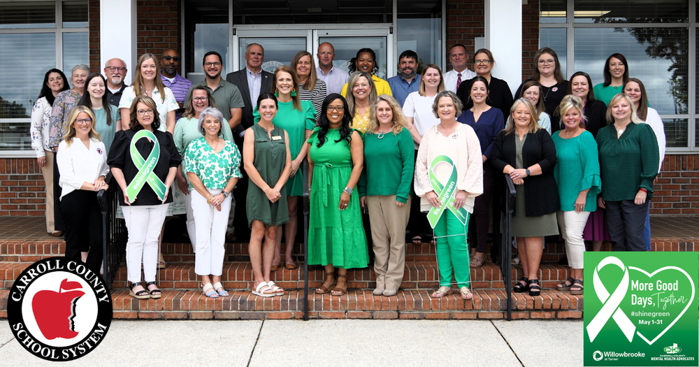 group of county office employees wearing green gathers with Tanner to celebration mental health awareness month