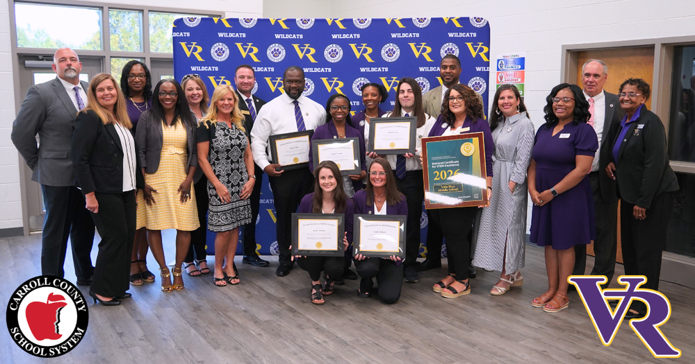 Villa Rica Middle School, cluster and system leaders pose as the school is awarded STEM certification