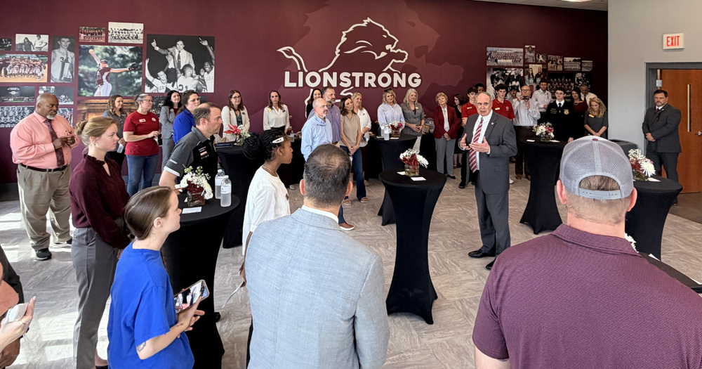 Central cluster community members gathered at central high school listening as Scott Cowart gives updates.