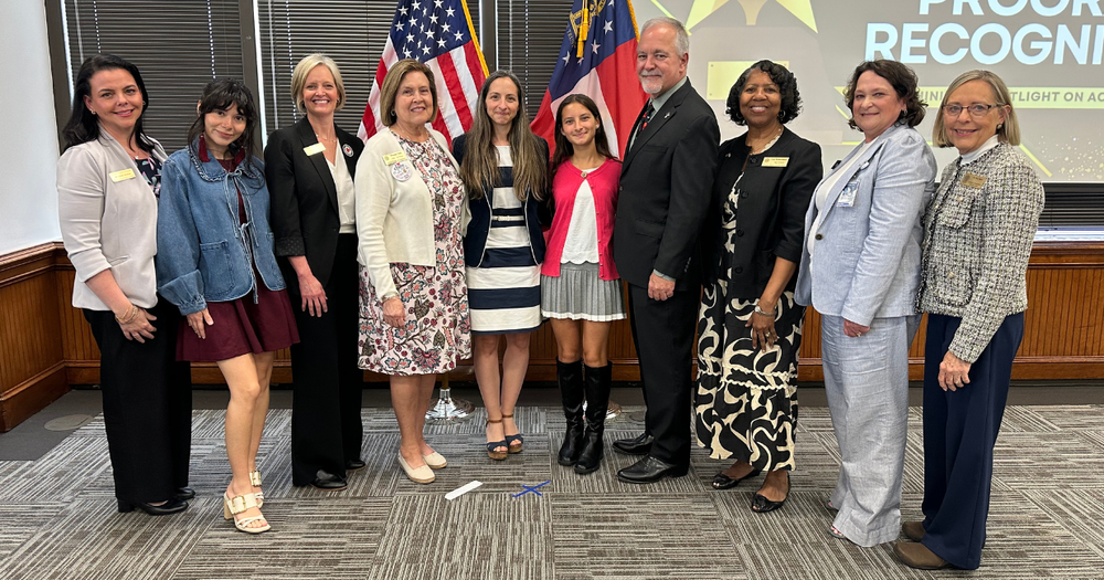 Pictured are (l-r) Carroll County Schools ESOL Facilitator Michelle Arana, CHS ESOL Teacher Crystal Fairbanks, Carroll County Schools Director of Federal Programs April Price, Georgia Board of Education Chair Phenna Petty, Alicia Nunez Rosendo (Paola's mom), Paola Nunez Rosendo, State School Superintendent Richard Woods, state BOE member Lisa Kinnamore, state BOE member Melanie Stockwell, and Senior Program Manager for ESOL Dr. Margaret Baker.