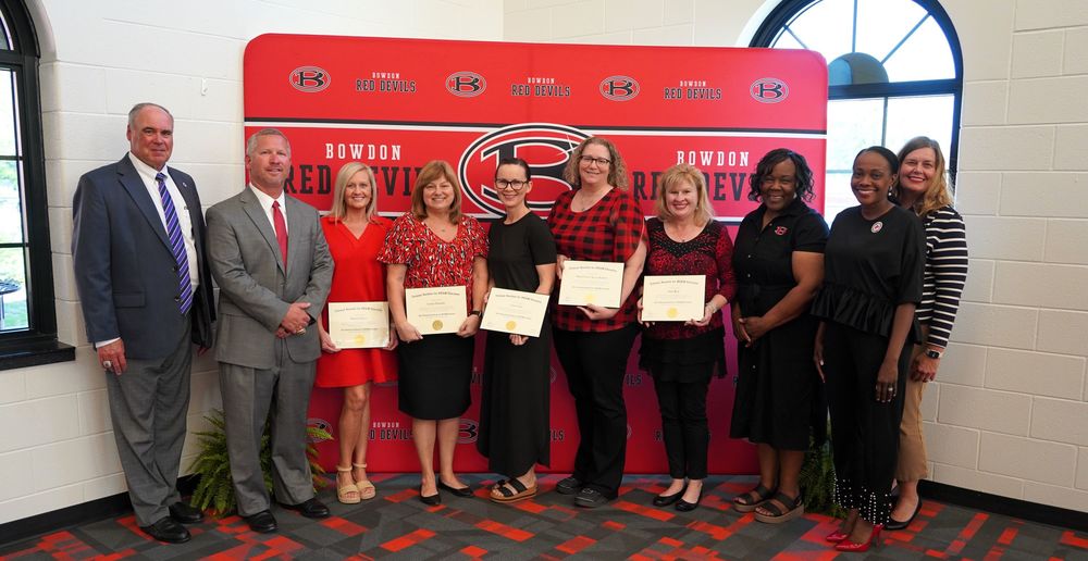 Five Bowdon High School teachers earned individual STEM certification as part of the school's National STEM certification process. Carroll County Schools Superintendent Scott Cowart and BHS Principal Jeff Bryant are shown with STEM certified teachers Melanie Burns, Laura Edwards, Carrie Gay, Rachel Kakesh and Dana Ray. Director of Professional Learning, Assessment and Accountability Cheryl Clark and Executive Director of Teaching and Learning Jennifer Shirley joined in the celebration.