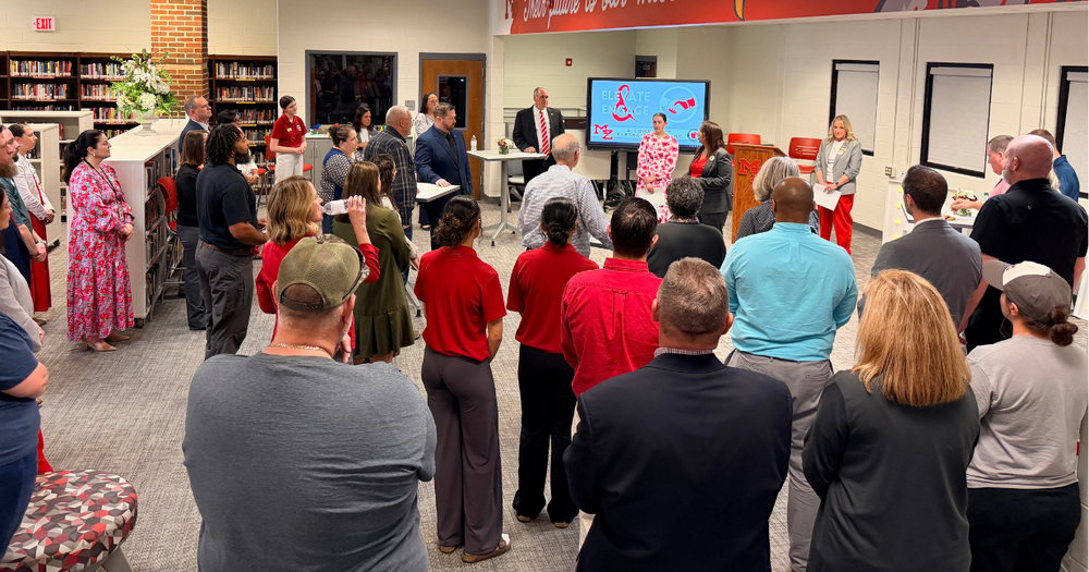 a crowd of Mount Zion community members listens as district and cluster leaders share updates