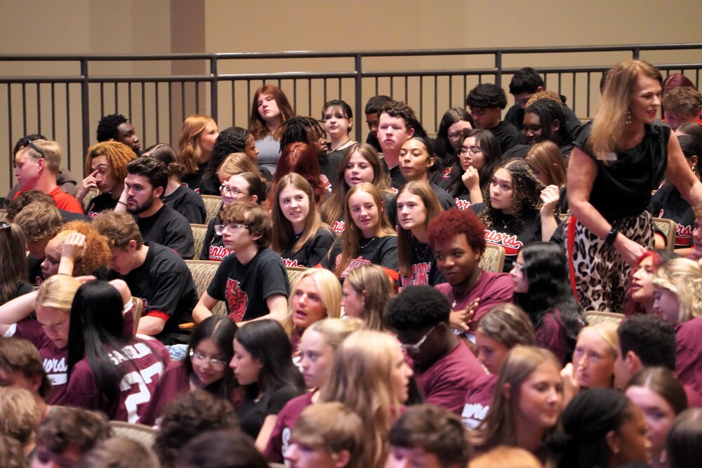 a crowd of high school seniors at the performing arts center