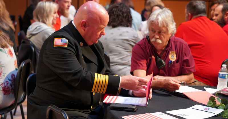 fire chief dave wade talks with bowdon police chief mark brock