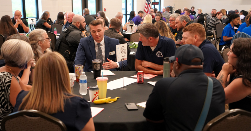 CCA leaders talk with EMA personnel