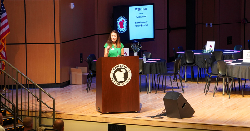 Chairman Michelle morgan addresses the crowd from stage at the safety summit