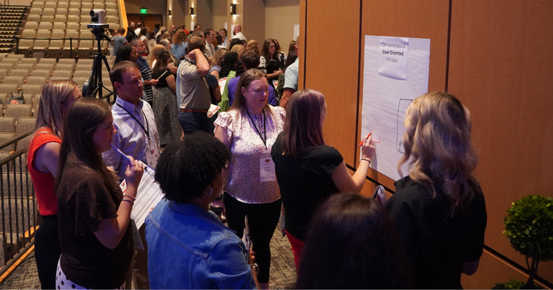 teachers work together on posters during TIP