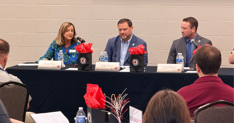 board member sandra morris and principals share in a panel discussion for fine arts teachers..