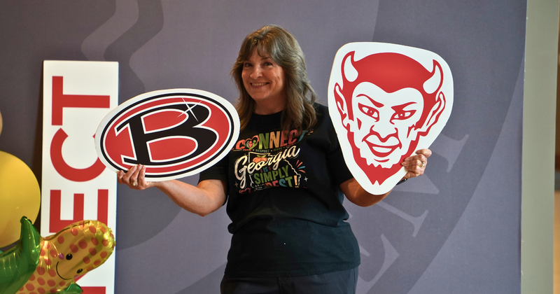Regina Jones shows off logos from her beloved Bowdon Red Devils