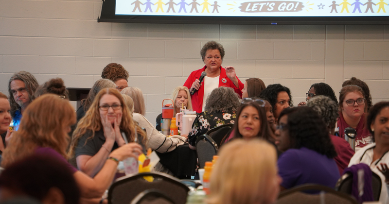 School nutrition director Bridgett Cross addresses workers