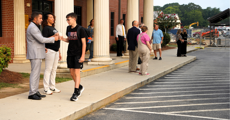 THS students are greeted by community members at their annual Invest 30 event.