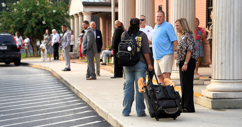THS students are greeted by community members at their annual Invest 30 event.