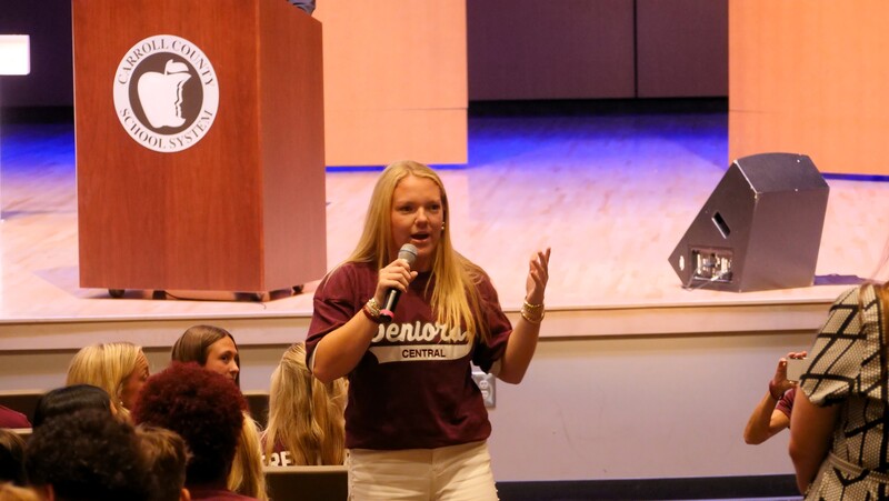 a central high senior speaks into a microphone