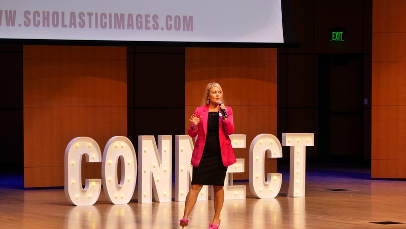a scholastic images representative speaks on stage